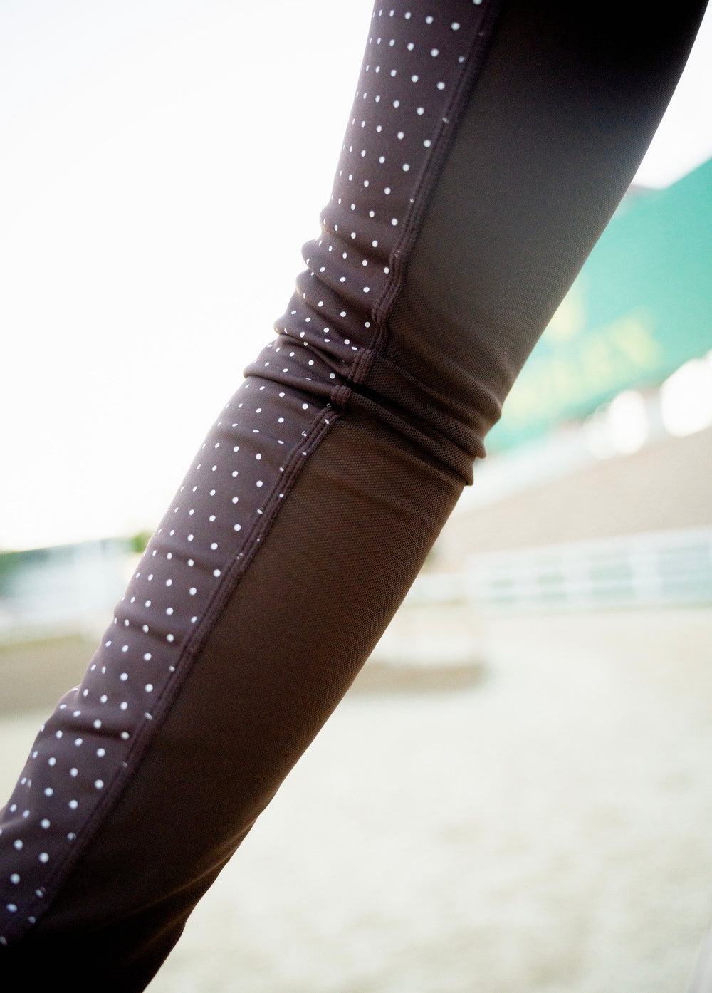 Close-up of breathable mesh under the sleeve of the brown Airform Polka Dot shirt